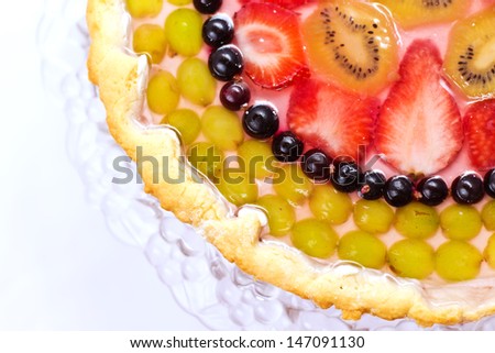 Cake from fruits and berries covered with jelly. View from above.
