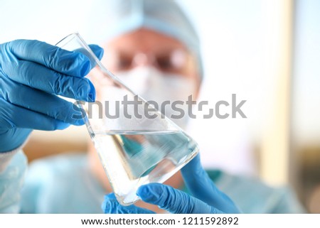 Male scientist hold in arm empty vials closeup. Chemical lab exam food additives medical blend concentrate acid measurement innovation drug toxic poison infection measure microbiology concept