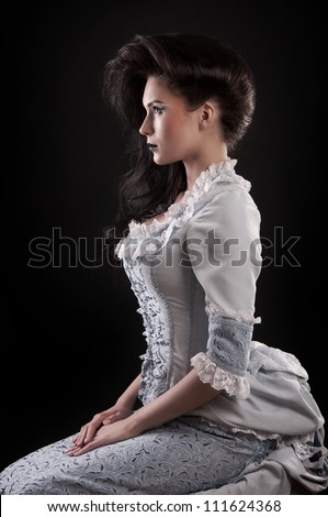portrait of vampire woman aristocrat with stage makeup isolated on black