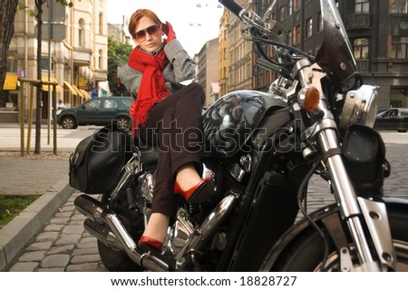 Beautiful woman on the motorcycle
