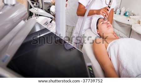 Young woman getting skin cleaning at beauty salon