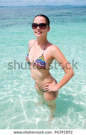 Happy smiling woman in sea water