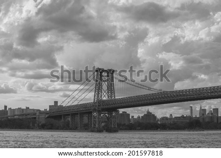 NEW YORK - JUNE 27: The Williamsburg Bridge on June 27th, 2014 in Brooklyn, New York. The Williamsburg Bridge  is one of four toll-free crossings between Manhattan and Brooklyn or Queens.