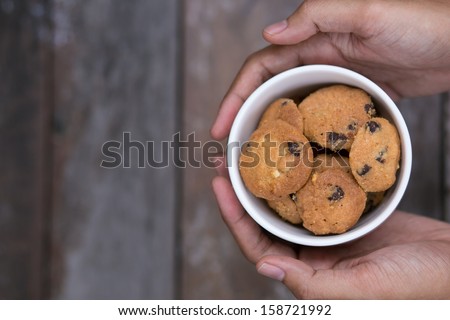 Close up cookies in the palm of hands