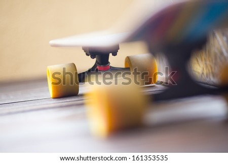 Colorful Cruiser Skate Board With Yellow Wheels In Perspective View
