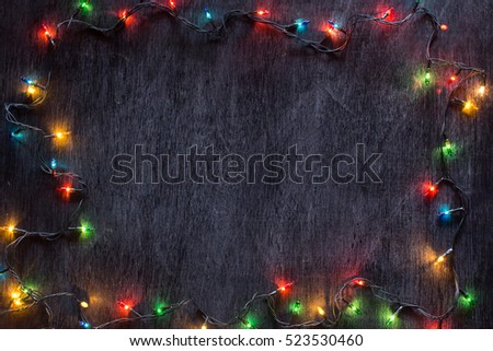 Colourful of decorative light on black paint wood with white chalk effect, for centre text.
