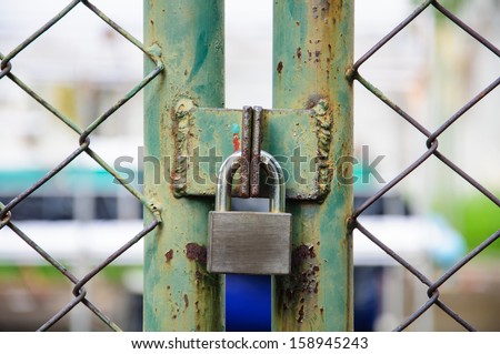 Chain link fence and metal door with lock