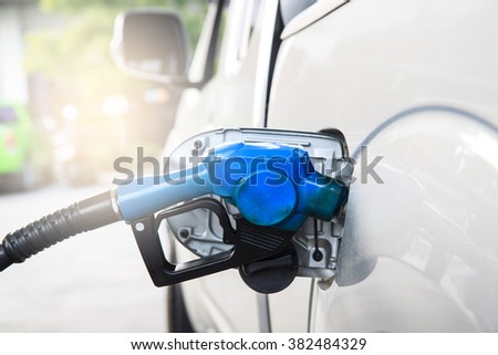 Car refill fuel or gas or add fuel at gas station. fuel green power.