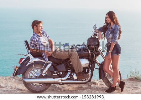 Two People And Bike - Fashion Woman And Man. Adventure And Vacations Concept