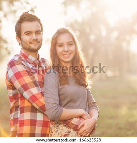 Young couple in love walking in the park
