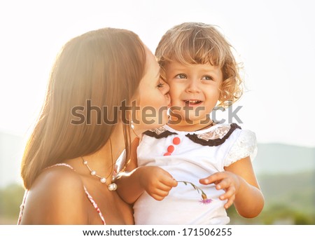 Mother and daughter having fun in the park Mother and daughter having fun in the park