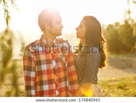 Young couple in love walking in the park