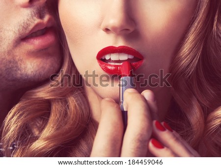 Beautiful portrait of young man lips red lipstick