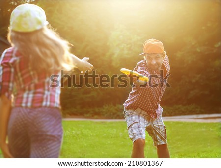 AÂ  father and daughter spend a fun time at the park playing  plate