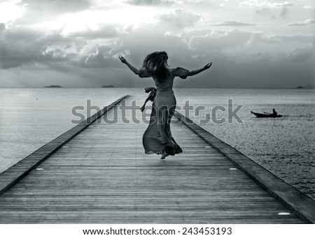 girl runs across the bridge