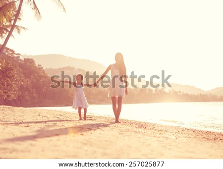 mother and daughter happy in love at sunset