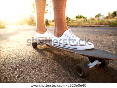guy on skateboard at sunset