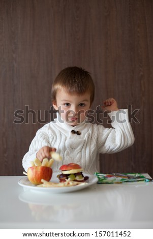Boy, eating fruit sandwich