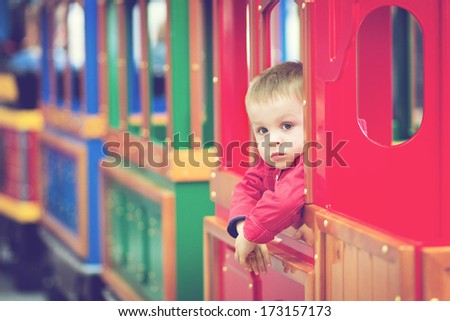 Little Boy In A Colorful Train