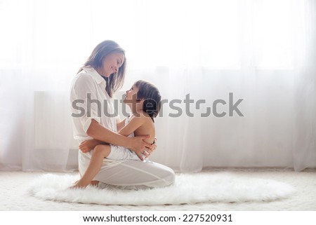 Mother and her child, embracing with tenderness and care