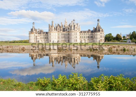 Chateau de Chambord, royal medieval french castle with reflection in the water canal in front of it at Loire Valley, France, Europe