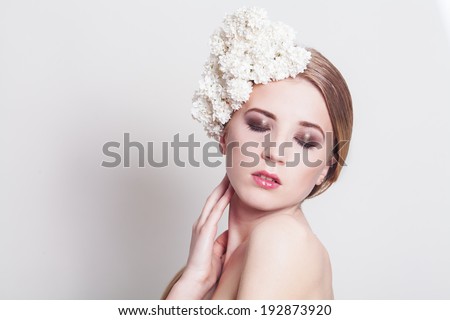BEAUTY portrait of a girl with flowers in her hair. Girl with the white  lilac flowers. Fresh Clean Skin.