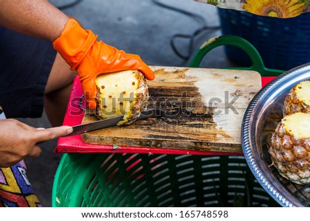 Hand peeling pineapple for sell