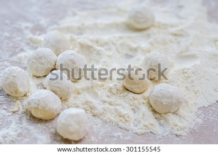 Dough balls for cooking on wooden table