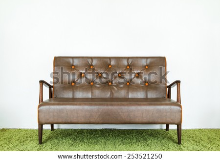 Vintage leather sofa with brown and made of solid wood.