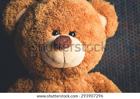 Cute teddy bears with old metal background. Unique Perspectives