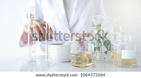 the scientist,doctor, make alternative herb medicine with herbal the organic natural in the laboratory. oil capsule, natural organic skincare and cosmetic.
