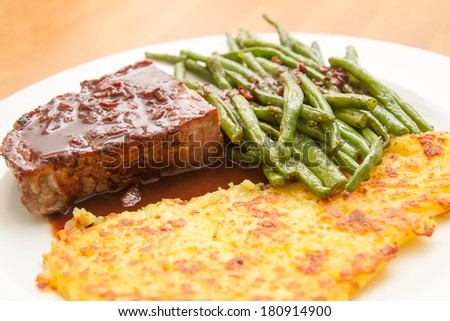 Dry aged steak withpotato fritter and beans