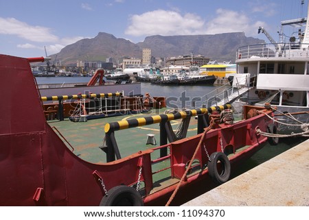 A view of ships in Cape Town Harbor with Table Mountain in the background