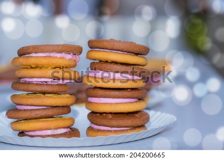 Chocolate and vanilla cookies on paper plates