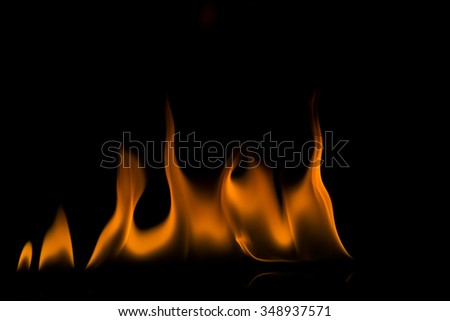 Abstract orange and black fire flames on a black background