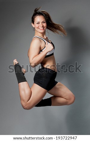 fitness woman jumping of joy