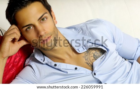 handsome dark-haired man wearing a blue shirt