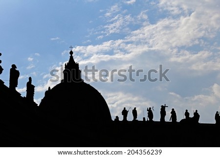 Silhouette of St. Peters Basilica over blue sky in Rome, Italy