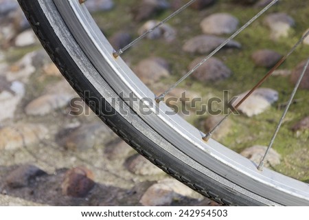Close-up of an old rusty bicycle wheel