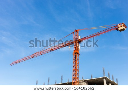 red cranes on a blue summer sky
