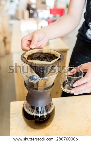 black coffee and coffee filters with coffee ground