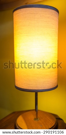 Table lamp isolated on wooden table