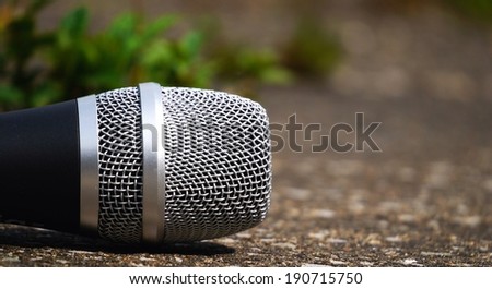 Microphone in open air environment, ready to sing outdoor gig.