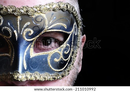 Man in fancy dress mask or masque.
