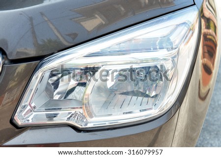 Closeup headlights of car. Pickup Truck