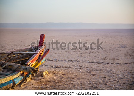 Colourful Boat in desert at dawn. Tunisia