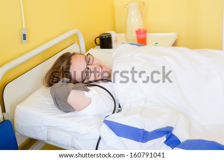 Sick patient in hospital bed