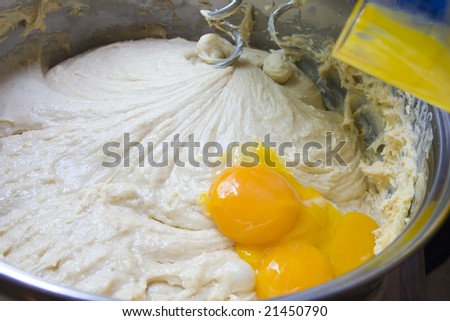 Dough beating with electric mixer - close up