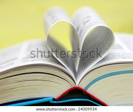 loving books (pages of book curved into a heart shape)