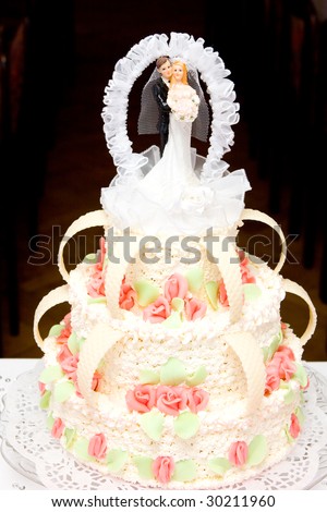 Wedding cake with wedding couple on top